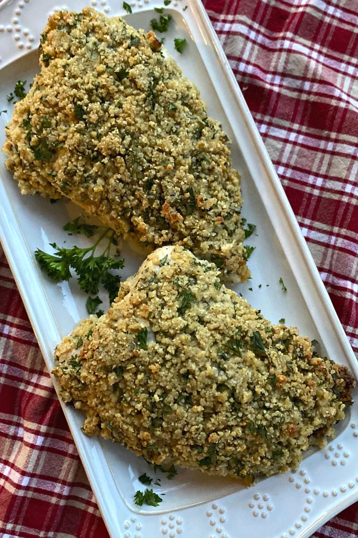 Turkey tenderloin with a herb crust on a platter.