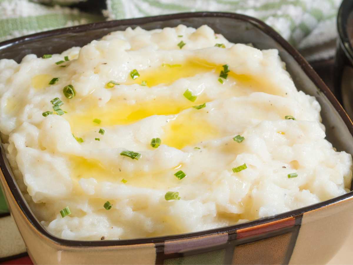 Creamy mashed potatoes in a serving bowl.