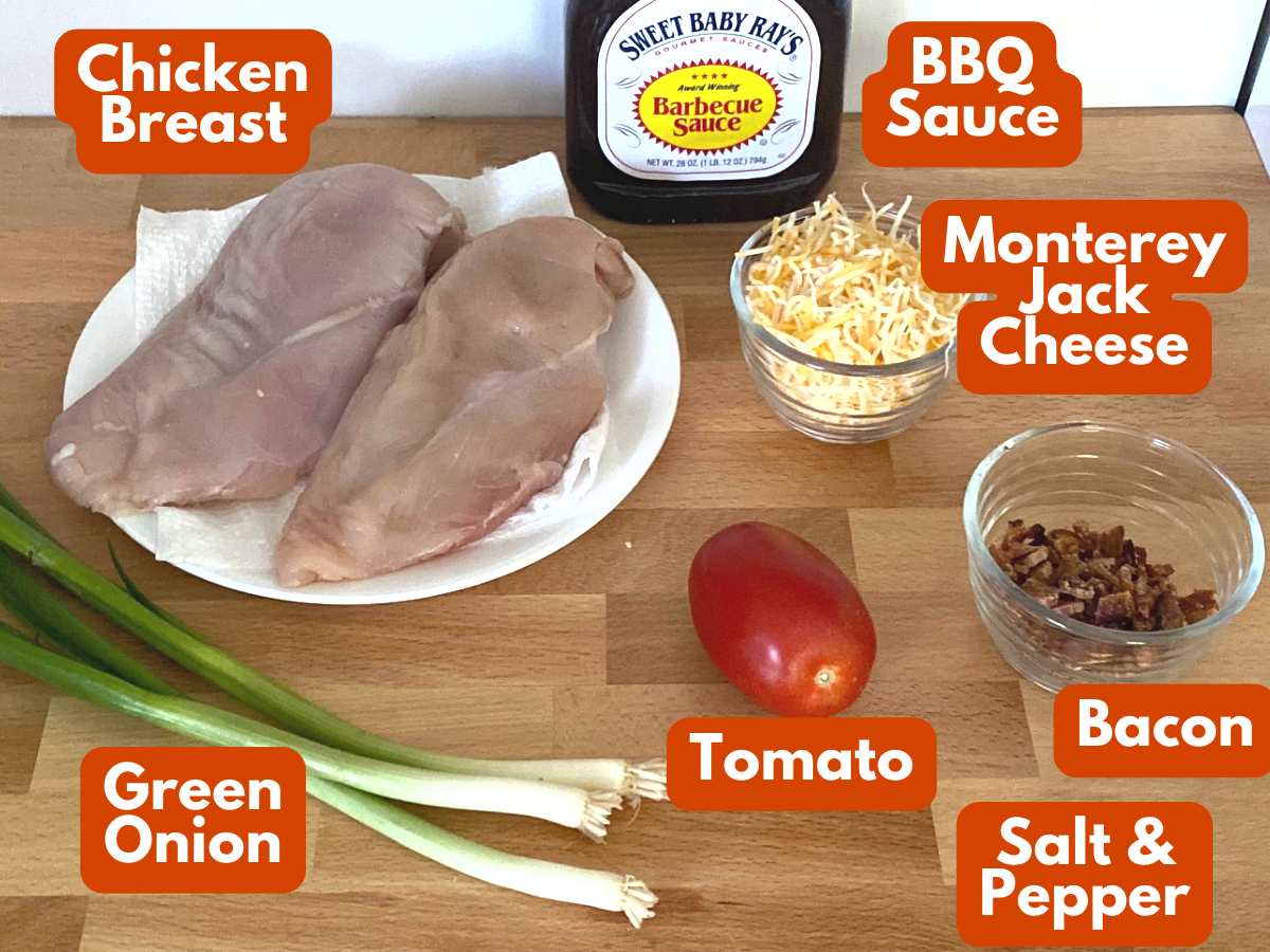 Ingredients to make Monterey Chicken: chicken breasts, barbecue sauce, Monterey Jack cheese, crumbled bacon, tomato, green onions.