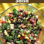 Corn and black bean salsa with red wine vinegar dressing in a glass bowl.