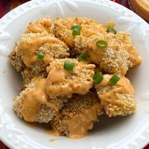 Healthy bang bang chicken that was baked in the oven in a bowl.