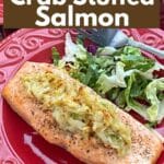 Crab Stuffed Salmon on plate with salad greens and a fork.