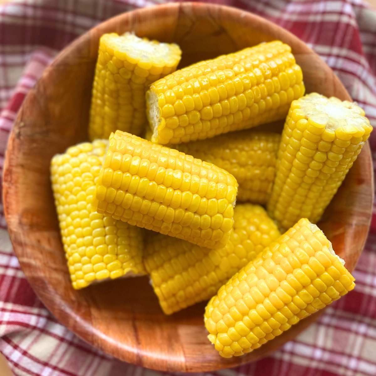 Bowl with 4 inch segments of corn on the cob.