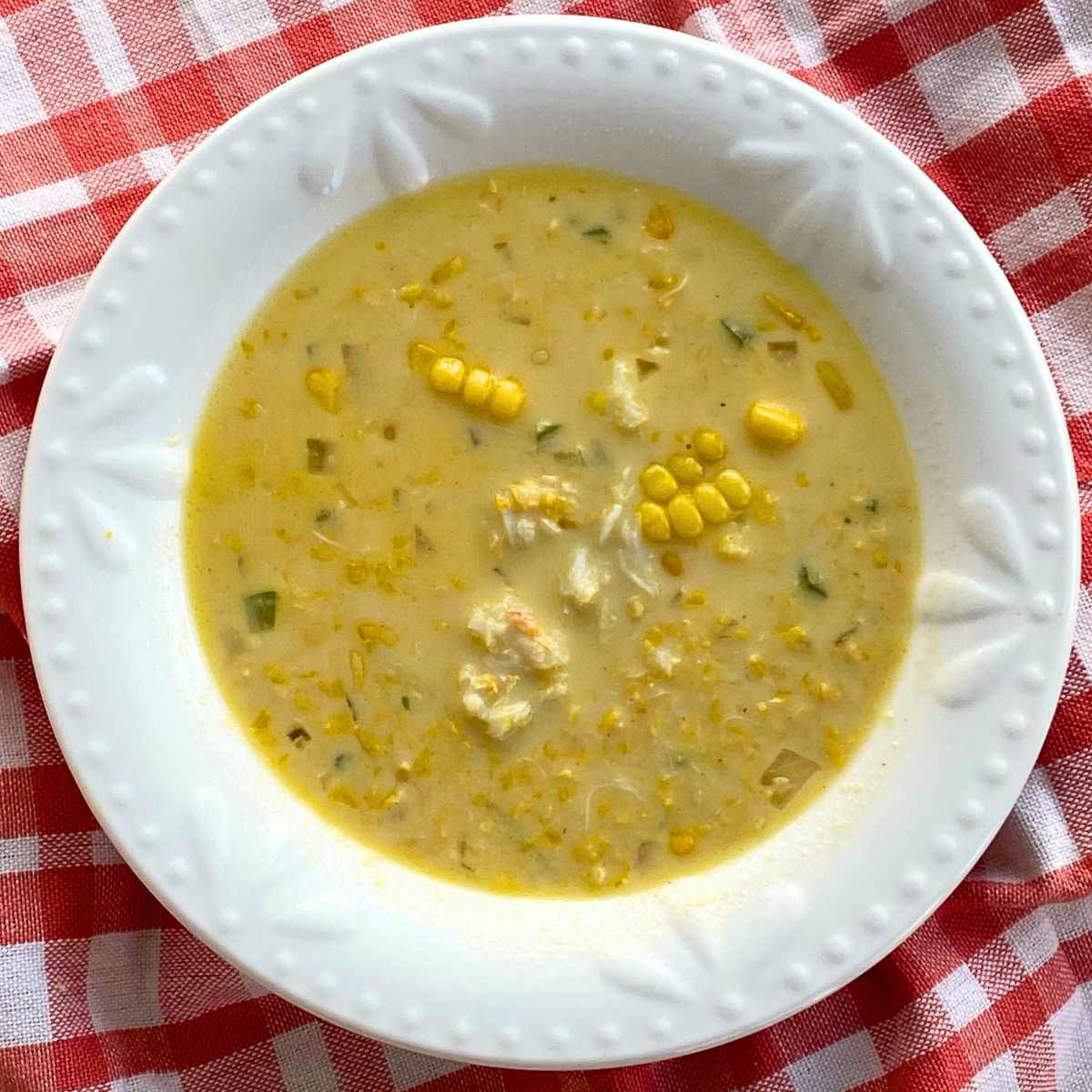 Single serving bowl of crab corn chowder.