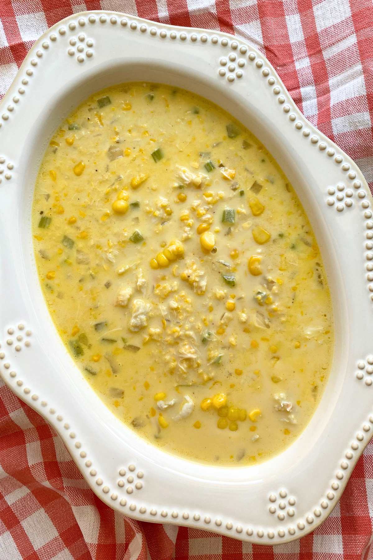 Oblong serving bowl with creamy crab corn soup recipe.