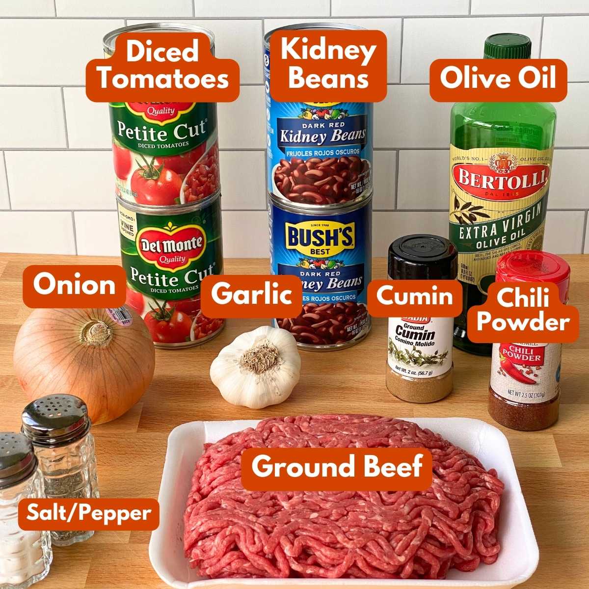 Ingredient to make chili recipe: ground beef, 2 cans kidney beans, 2 cans diced tomatoes, onion, garlic, chili powder, cumin, olive oil, salt and pepper.