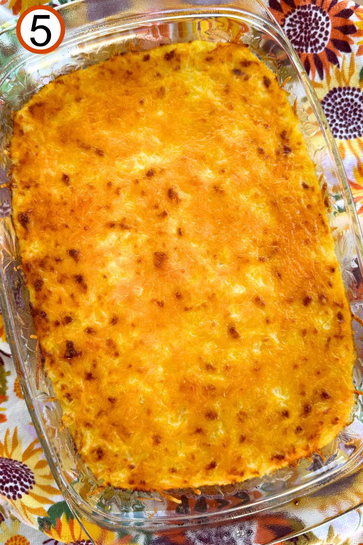 Baked spaghetti squash au gratin in a casserole dish.