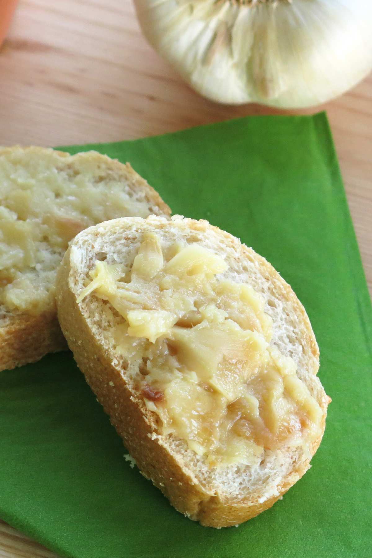 Roasted garlic spread on two slices of bread.