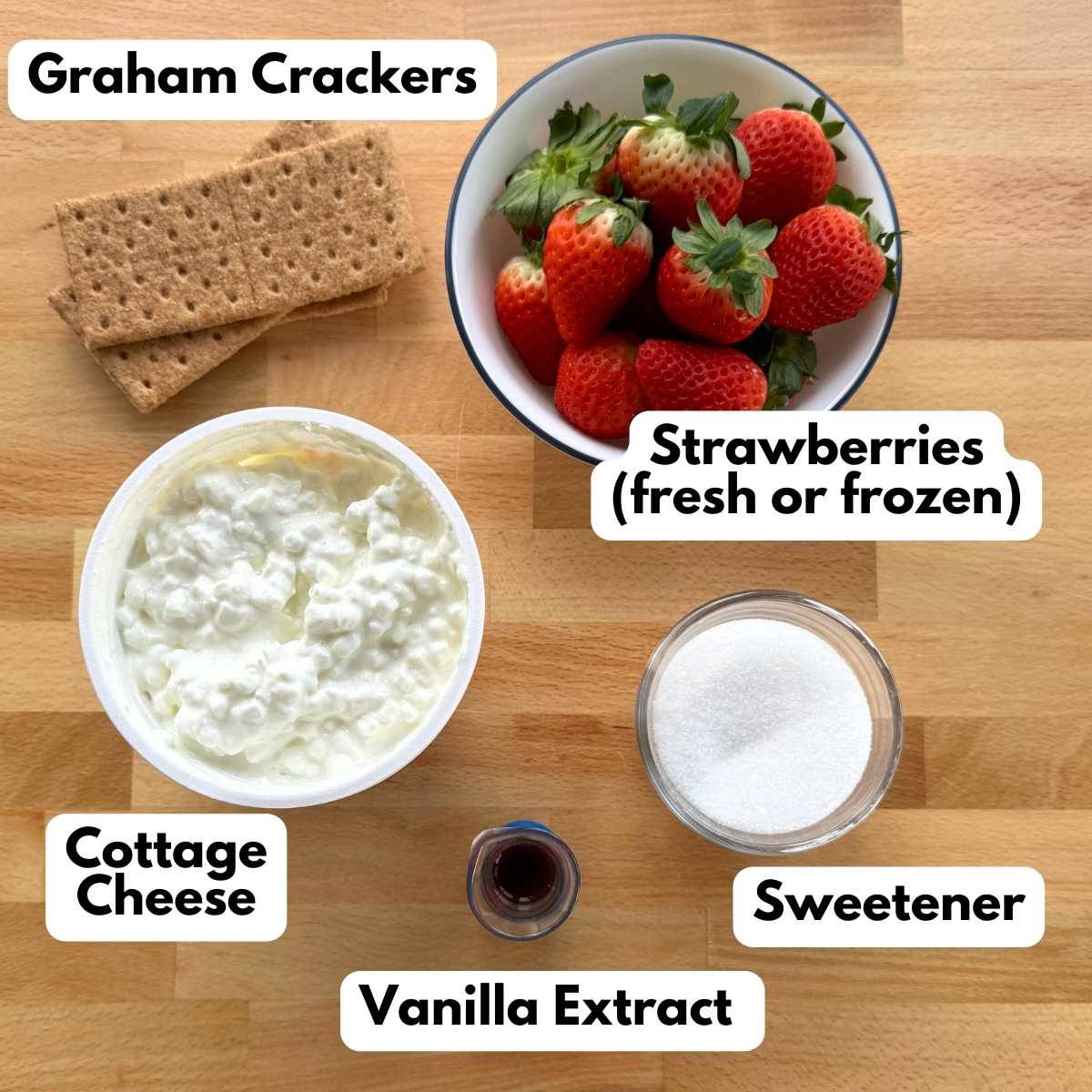 Labeled Ingredients to make recipe: cottage cheese, vanilla extract, stevia sweetener, strawberries, and graham crackers.