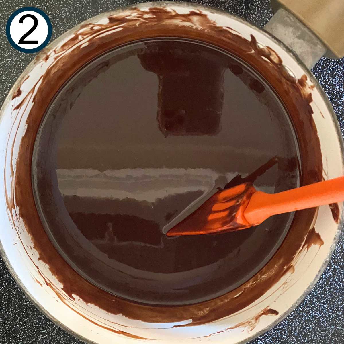 Melted butter and chocolate in a medium-sized sauce pan.