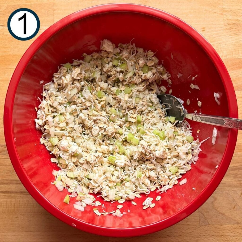 Oatmeal, mozzarella cheese, blue cheese, celery, and onion mixed together in a large bowl.