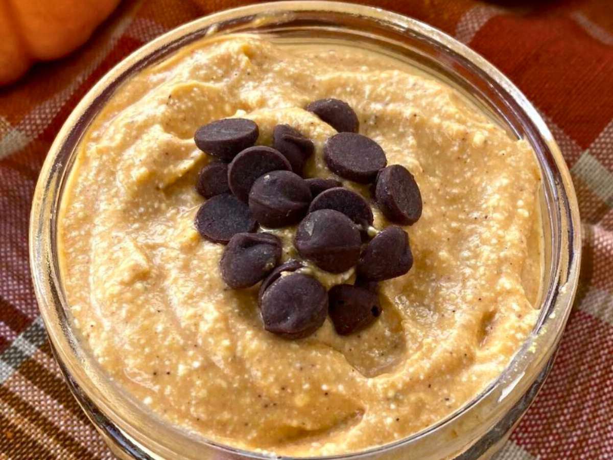Pumpkin cottage cheese in a bowl topped with chocolate chips.