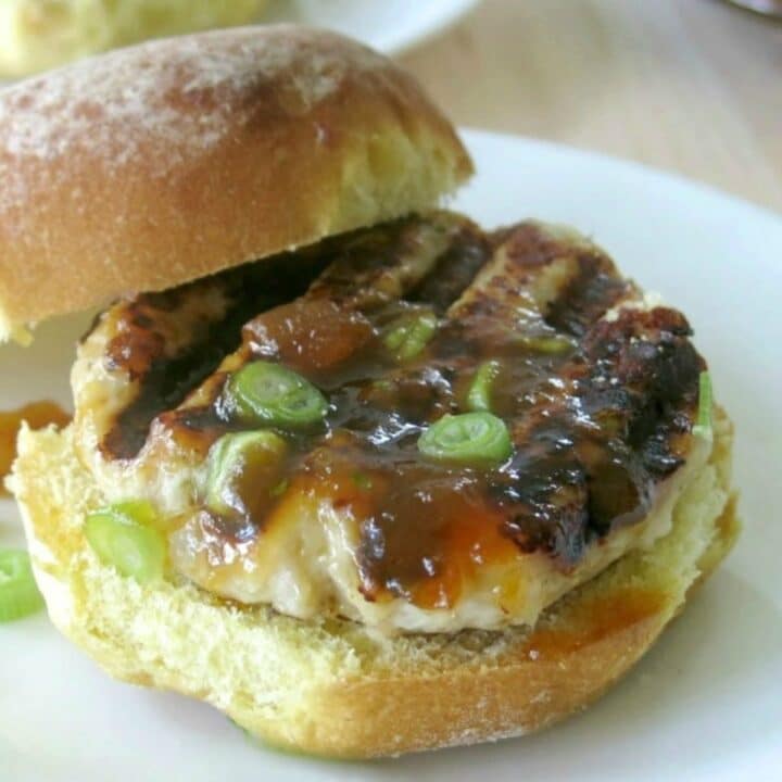 Juicy ground turkey burger with mango chutney on a bun.