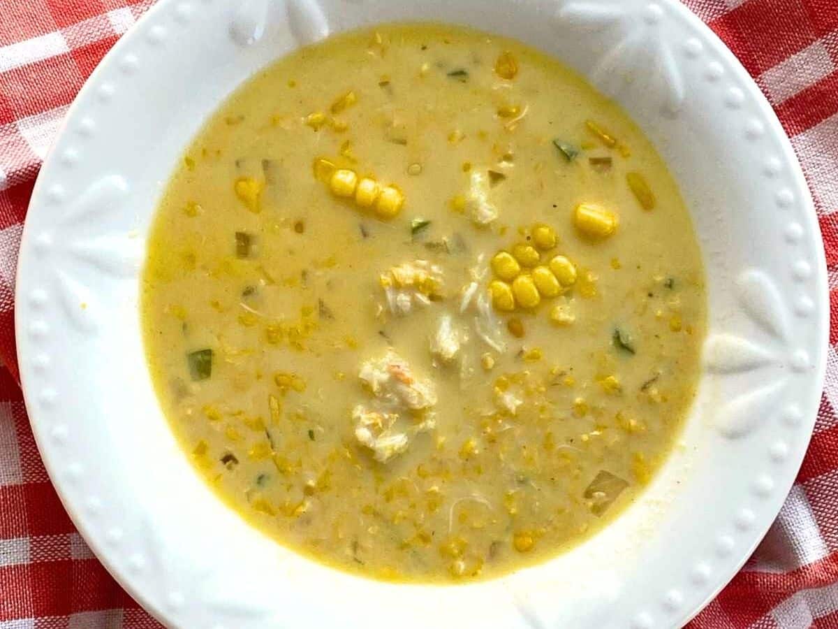 Crab and corn chowder in a white bowl.