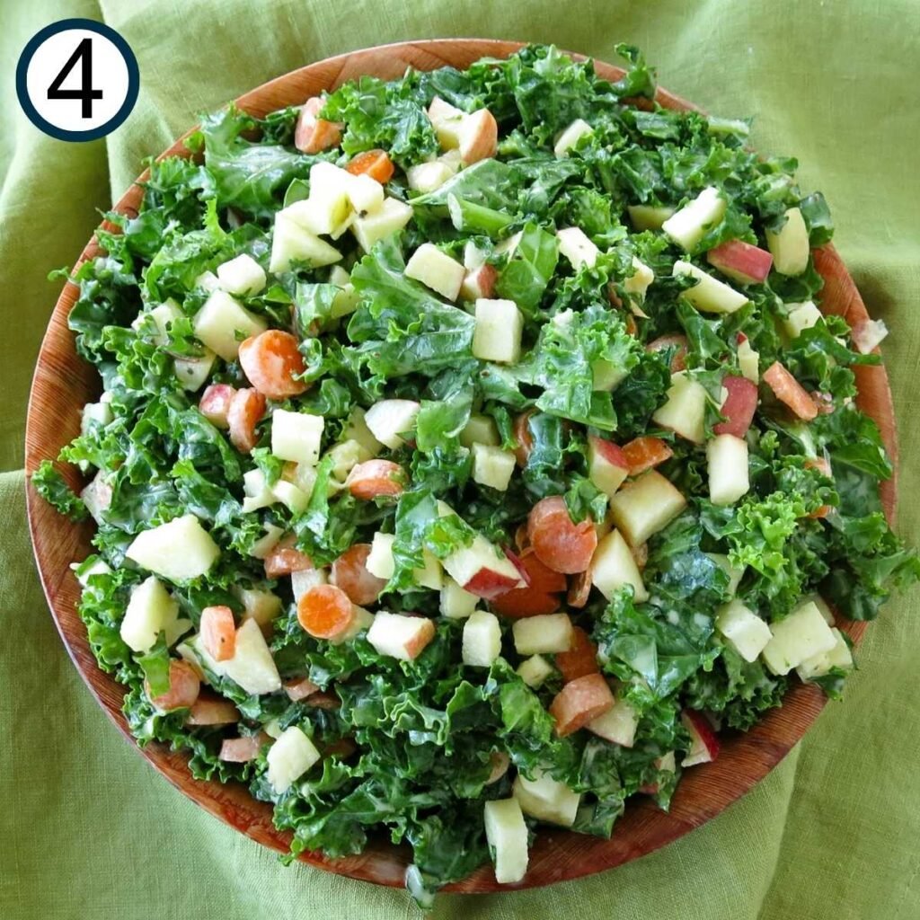 Brown bowl with mixed kale apple slaw.