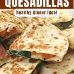 Butternut squash quesadillas cut into triangles on a plate.