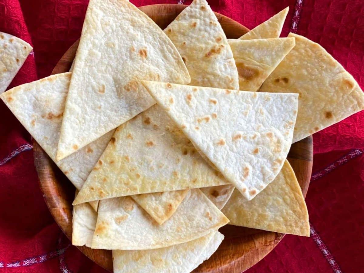 Low-carb tortilla chips on a red napkin.