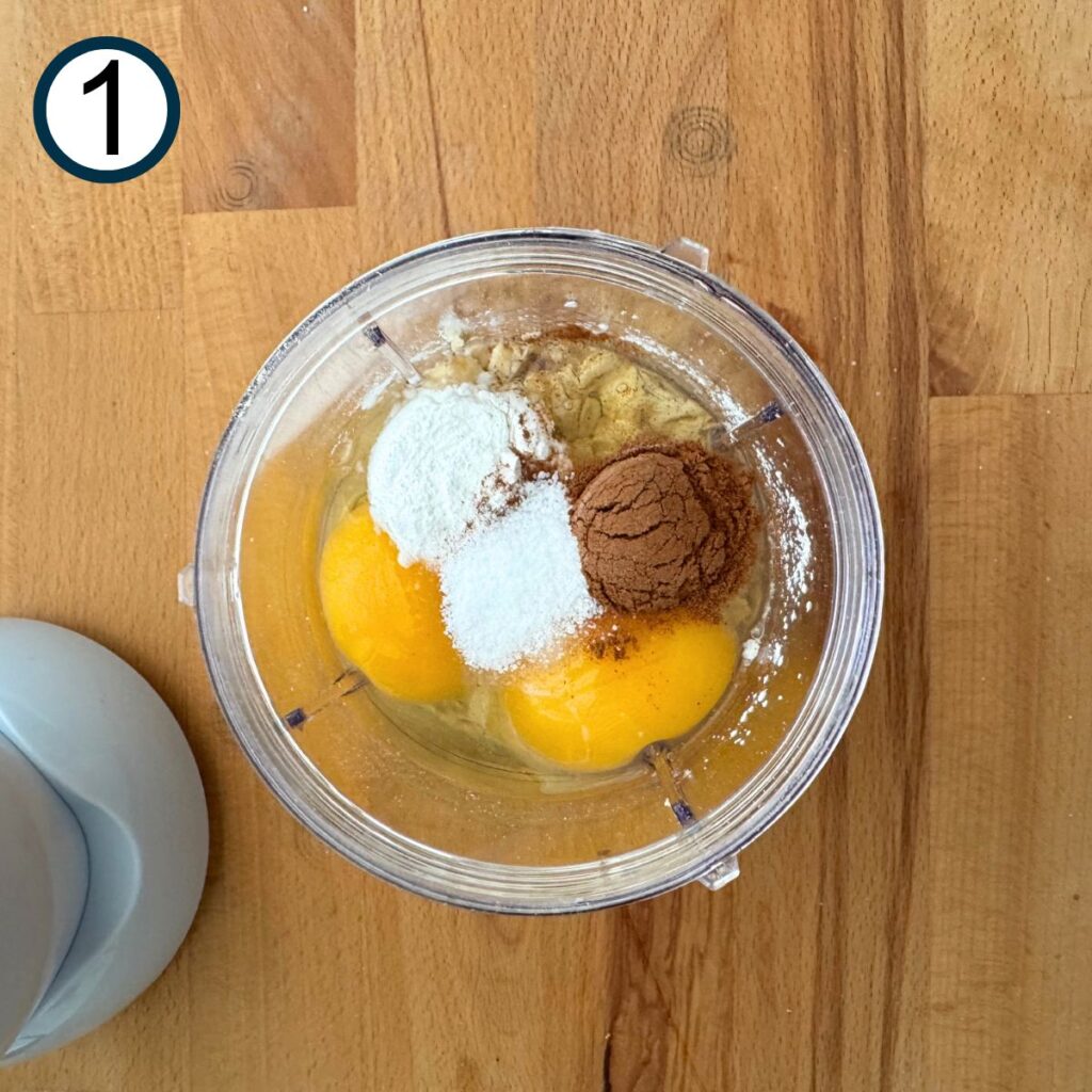 Oats, cottage cheese, eggs, baking powder, and cinnamon in the base of small blender.