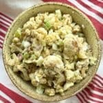 Roasted cauliflower potato salad from frozen cauliflower with a Greek yogurt dressing in a light brown bowl.