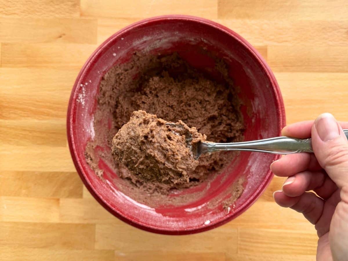 Thick chocolate zucchini muffin batter made with Greek yogurt before adding shredded zucchini.