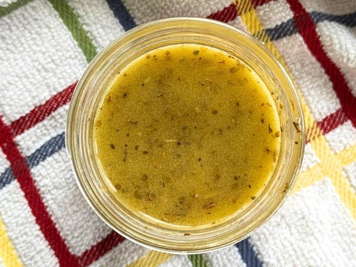 Jar with Greek vinaigrette.