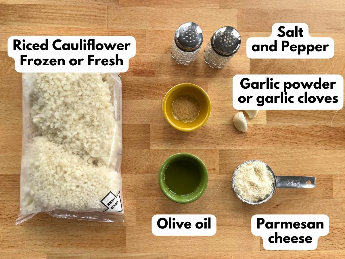 Bag of frozen riced cauliflower, garlic powder, garlic cloves, olive oil, salt, pepper and Parmesan cheese.