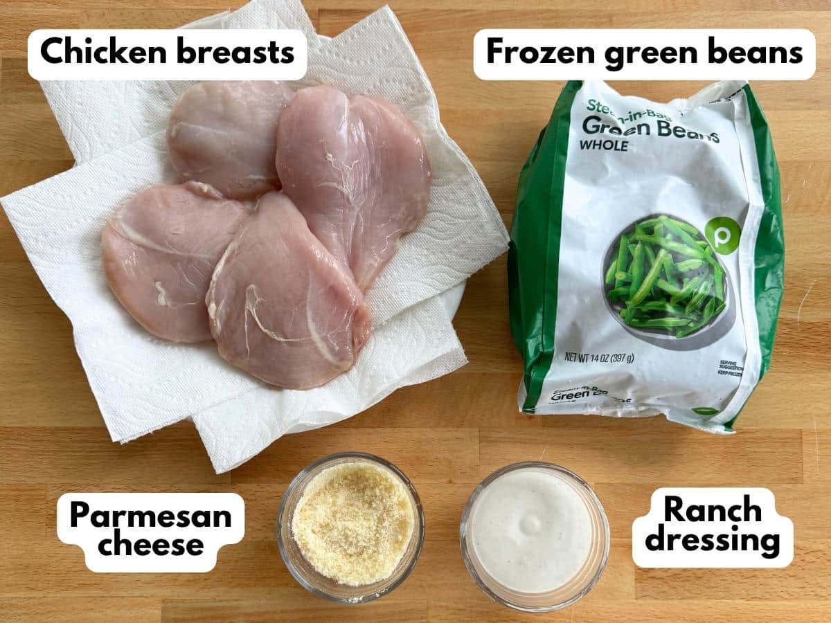 Four chicken breasts, package of frozen green beans, Parmesan cheese, and ranch dressing.