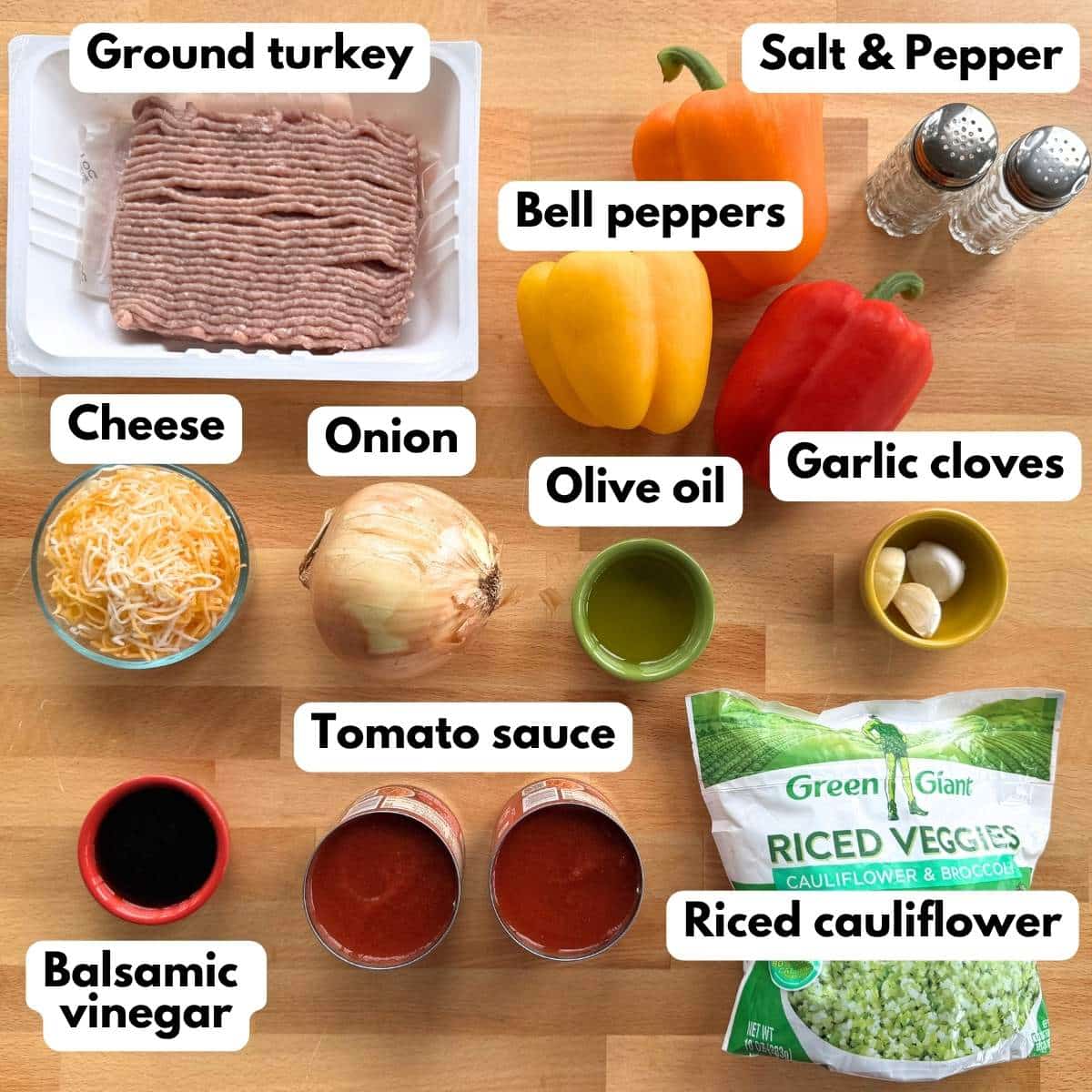 Ingredients for unstuffed bell peppers including ground turkey, bell peppers, cauliflower rice, tomato sauce, onion, garlic, Monterey Jack cheese, olive oil, balsamic vinegar, salt, and pepper.