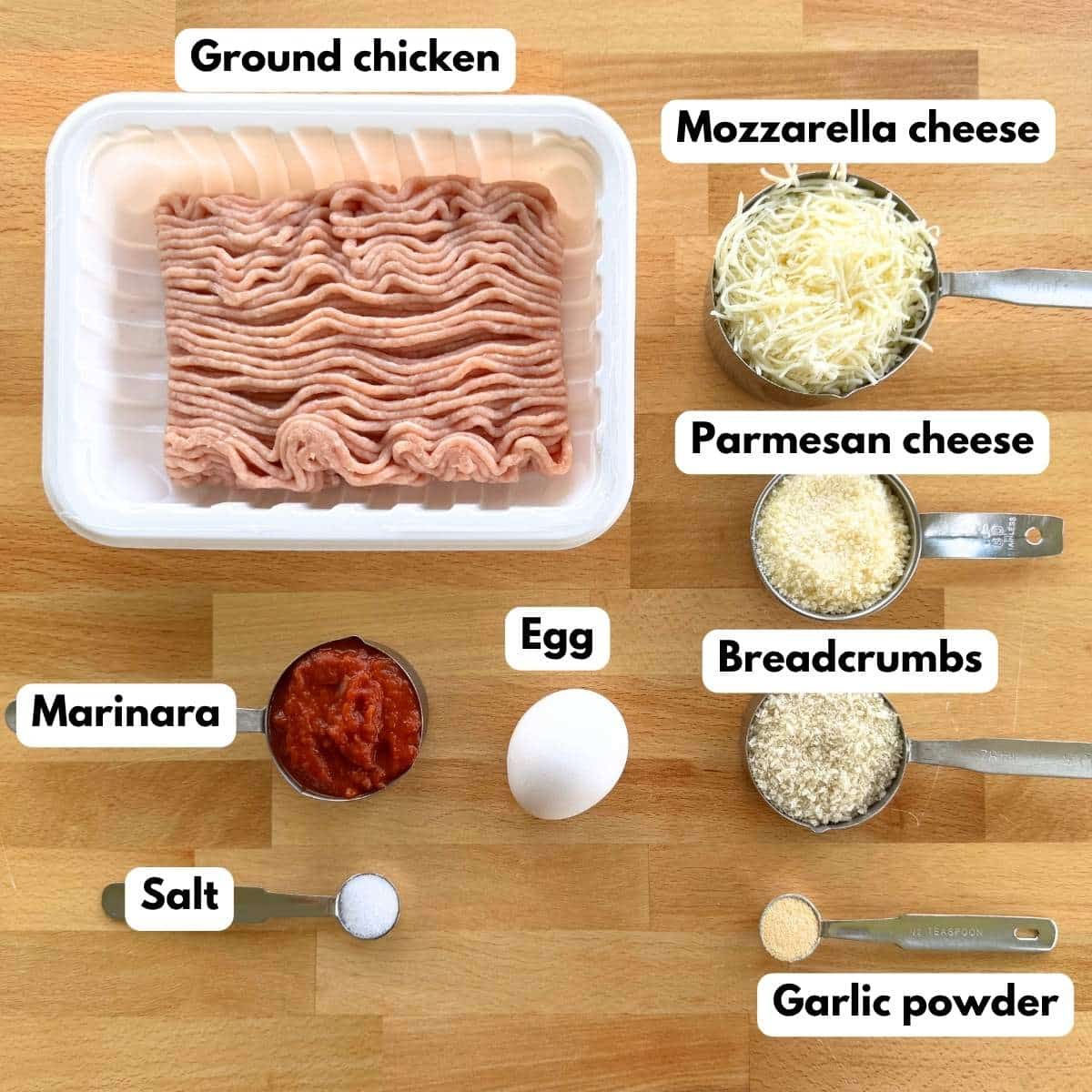Collage of ingredients to make chicken Parmesan meatballs: Ground chicken, marinara, egg, Parmesan cheese, Mozzarella cheese, Panko breadcrumbs, garlic powder, and salt.