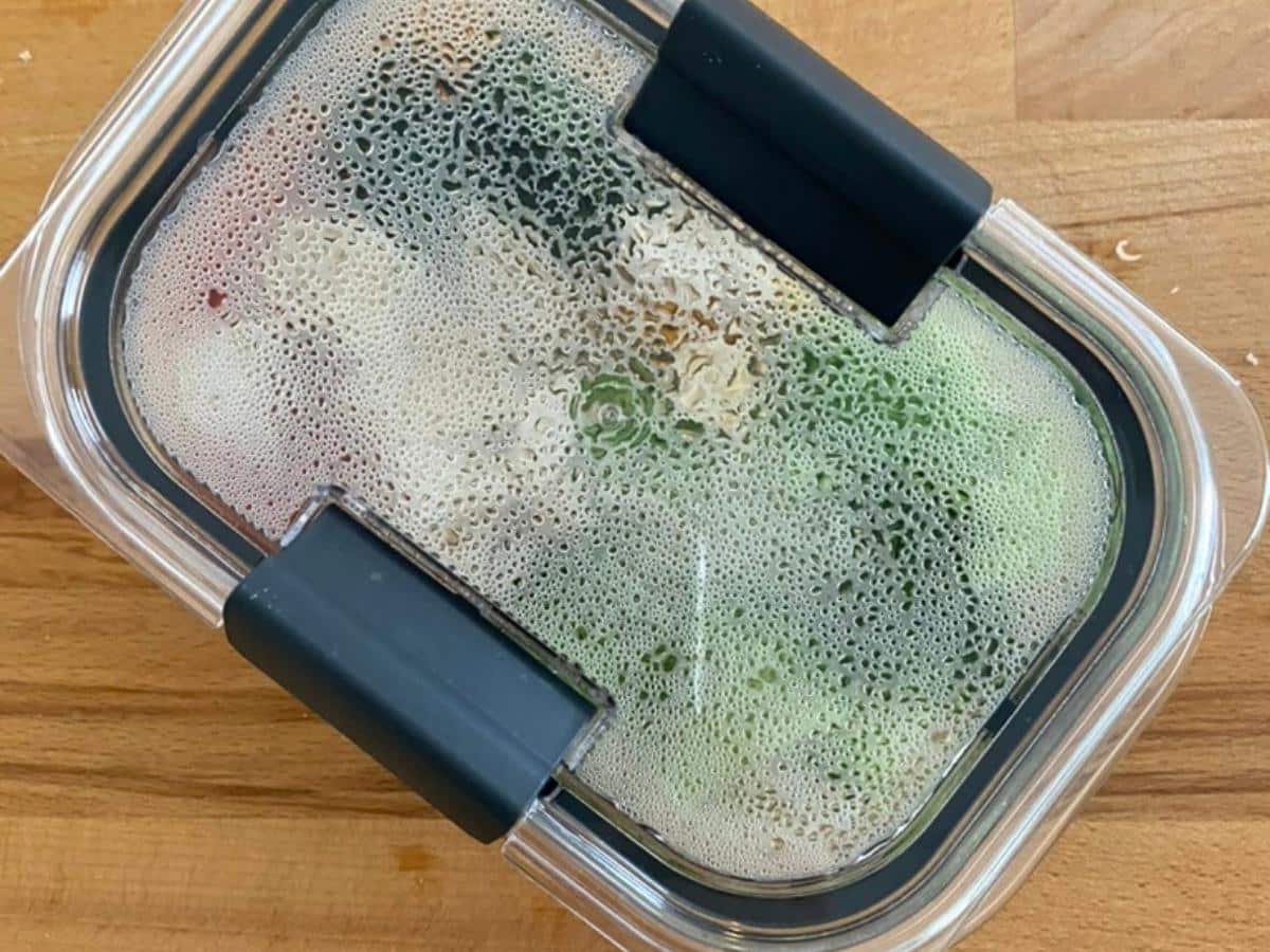 Chicken marinara meal prep bowl covered and ready to microwave.