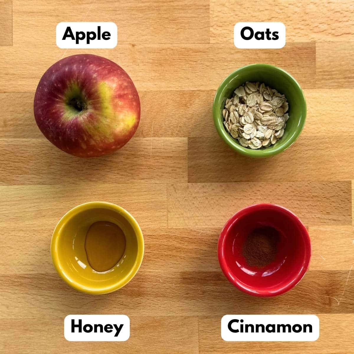 Ingredients for microwave baked apples: apple, oats, honey, and cinnamon.