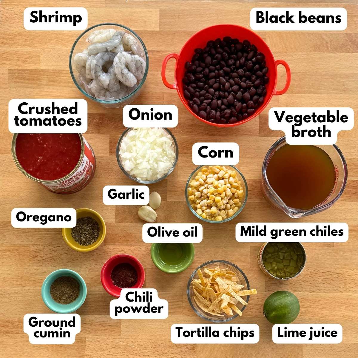 Ingredients for shrimp tortilla soup including shrimp, black beans, corn, tomatoes, green chiles, broth, lime, and seasonings.