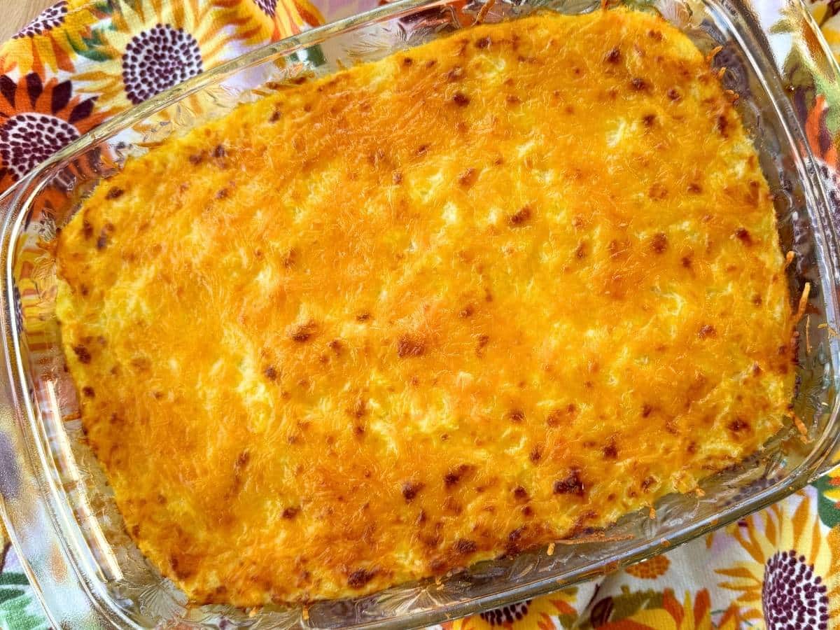 Baked spaghetti squash au gratin casserole with a golden melted cheese topping.