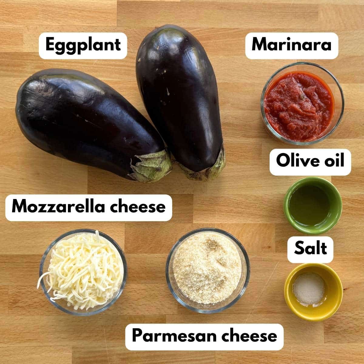 Eggplant Parmesan stacks ingredients including eggplant, marinara, mozzarella, Parmesan, olive oil, and salt.